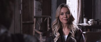 Movie still from “Tucker and Dale vs Evil” (2010), directed by Eli Craig – A woman with long blonde hair standing in a room; Close Up shot, Over the shoulder angle