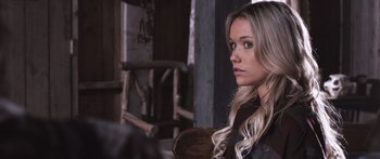 Movie still from “Tucker and Dale vs Evil” (2010), directed by Eli Craig – A woman with long blonde hair sitting in a chair; Close Up shot, Over the shoulder angle