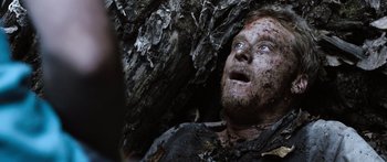 Movie still from “Tucker and Dale vs Evil” (2010), directed by Eli Craig – A person with mud all over his face; Close Up shot, Low angle