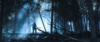 Movie still from “Tucker and Dale vs Evil” (2010), directed by Eli Craig – A man standing in the middle of a forest; Wide shot, Low angle