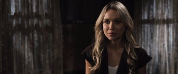 Movie still from “Tucker and Dale vs Evil” (2010), directed by Eli Craig – A woman with long blonde hair wearing a black jacket; Close Up shot, Over the shoulder angle