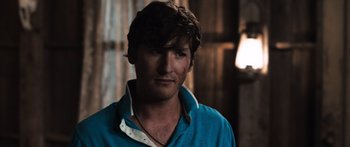 Movie still from “Tucker and Dale vs Evil” (2010), directed by Eli Craig – A person wearing a blue shirt; Close Up shot, Over the shoulder angle