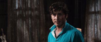 Movie still from “Tucker and Dale vs Evil” (2010), directed by Eli Craig – A person wearing a blue shirt; Close Up shot, Over the shoulder angle