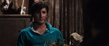 Movie still from “Tucker and Dale vs Evil” (2010), directed by Eli Craig – A man in a blue shirt is looking at the camera; Close Up shot, Over the shoulder angle