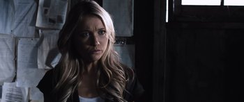 Movie still from “Tucker and Dale vs Evil” (2010), directed by Eli Craig – A woman with long blonde hair looking at the camera; Close Up shot, Over the shoulder angle
