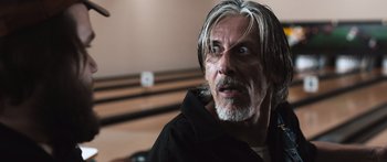 Movie still from “Tucker and Dale vs Evil” (2010), directed by Eli Craig – An older man with long white hair and a gray beard; Close Up shot, Low angle