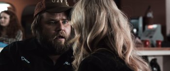 Movie still from “Tucker and Dale vs Evil” (2010), directed by Eli Craig – A man and a woman talking to each other; Close Up shot, Over the shoulder angle