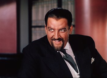 Movie still from “Heaven Can Wait” (1943), directed by Ernst Lubitsch – A person wearing a suit and tie; Close Up shot, Over the shoulder angle