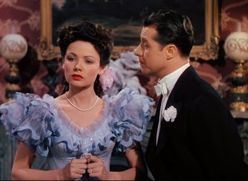 Movie still from “Heaven Can Wait” (1943), directed by Ernst Lubitsch – A man and a woman dressed in formal wear; Medium shot, High angle