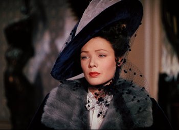 Movie still from “Heaven Can Wait” (1943), directed by Ernst Lubitsch – A woman wearing a hat and a fur stole; Close Up shot, Over the shoulder angle