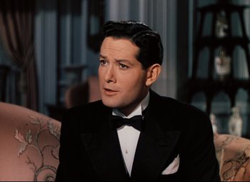 Movie still from “Heaven Can Wait” (1943), directed by Ernst Lubitsch – A person wearing a suit and bow tie; Close Up shot, High angle