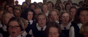 Movie still from “Heavenly Creatures” (1994), directed by Peter Jackson – A group of young people wearing school uniforms; Close Up shot, High angle