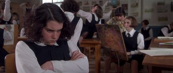 Movie still from “Heavenly Creatures” (1994), directed by Peter Jackson – A group of young people sitting in a room; Medium shot, Over the shoulder angle