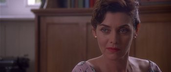 Movie still from “Heavenly Creatures” (1994), directed by Peter Jackson – A person with short brown hair; Close Up shot, Over the shoulder angle