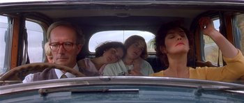 Movie still from “Heavenly Creatures” (1994), directed by Peter Jackson – A group of people sitting in the back of a car; Close Up shot, Low angle