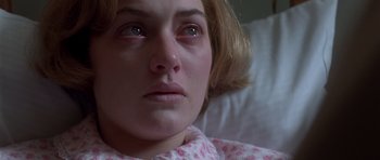 Movie still from “Heavenly Creatures” (1994), directed by Peter Jackson – A woman's eyes and face; Close Up shot, High angle