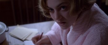 Movie still from “Heavenly Creatures” (1994), directed by Peter Jackson – A person writing with a pencil; Close Up shot, High angle