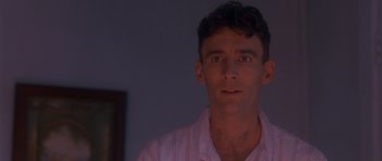 Movie still from “Heavenly Creatures” (1994), directed by Peter Jackson – A person wearing a pink shirt; Close Up shot, Low angle