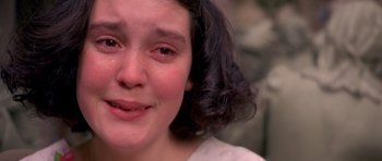 Movie still from “Heavenly Creatures” (1994), directed by Peter Jackson – A person with a crying face; Close Up shot, Over the shoulder angle