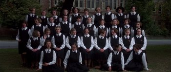 Movie still from “Heavenly Creatures” (1994), directed by Peter Jackson – A large group of people wearing black and white clothes; Wide shot, High angle