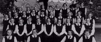 Movie still from “Heavenly Creatures” (1994), directed by Peter Jackson – An old photo of a group of girls in school uniforms; Wide shot, High angle
