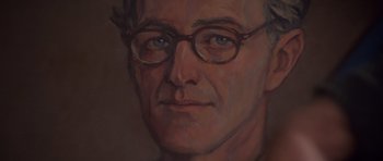 Movie still from “Heavenly Creatures” (1994), directed by Peter Jackson – A painting of a man wearing glasses; Extreme Close Up shot, Low angle