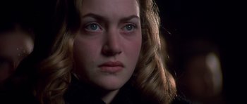 Movie still from “Heavenly Creatures” (1994), directed by Peter Jackson – A woman's face in the dark; Close Up shot, Over the shoulder angle