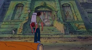 Movie still from “Heavy Metal” (1981), directed by Gerald Potterton – A man carrying a child on his back in front of a building; Wide shot, High angle