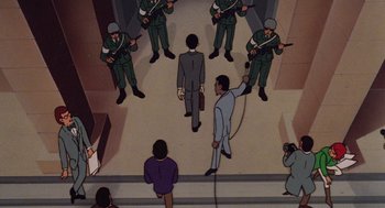 Movie still from “Heavy Metal” (1981), directed by Gerald Potterton – A group of men standing in front of each other in a room; Wide shot, High angle