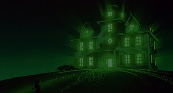 Movie still from “Heavy Metal” (1981), directed by Gerald Potterton – A car is parked in front of a large green house at night; Extreme Wide shot, Low angle
