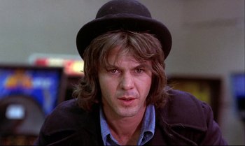 Movie still from “Heavy Traffic” (1973), directed by Ralph Bakshi – A person wearing a hat; Close Up shot, Low angle