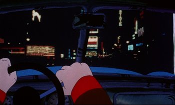 Movie still from “Heavy Traffic” (1973), directed by Ralph Bakshi – A hand holding the steering wheel of a car at night; Close Up shot, Low angle