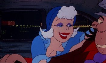 Movie still from “Heavy Traffic” (1973), directed by Ralph Bakshi – An animated woman in a blue dress is smiling; Close Up shot, Over the shoulder angle