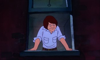 Movie still from “Heavy Traffic” (1973), directed by Ralph Bakshi – A cartoon of a man holding a knife in his hand; Medium shot, Low angle