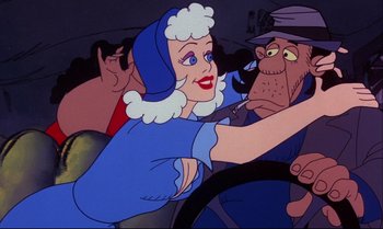 Movie still from “Heavy Traffic” (1973), directed by Ralph Bakshi – An animated woman driving a car in front of a group of men; Close Up shot, Over the shoulder angle