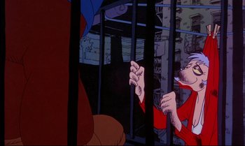 Movie still from “Heavy Traffic” (1973), directed by Ralph Bakshi – An animated scene of a man in a jail cell with a dog; Close Up shot, Low angle