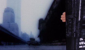 Movie still from “Heavy Traffic” (1973), directed by Ralph Bakshi – A person is holding a hand up to a smoke filled building; Close Up shot, Low angle