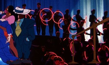 Movie still from “Heavy Traffic” (1973), directed by Ralph Bakshi – A group of people standing in front of a stage; Wide shot, Low angle