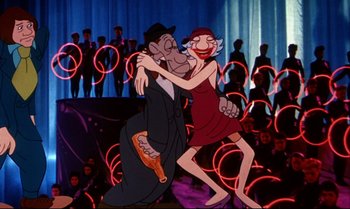 Movie still from “Heavy Traffic” (1973), directed by Ralph Bakshi – An animated scene of a man and a woman dancing in front of an audience; Wide shot, Overhead angle