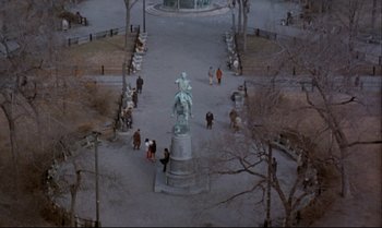 Movie still from “Heavy Traffic” (1973), directed by Ralph Bakshi – An aerial view of people walking around a park; Extreme Wide shot, High angle