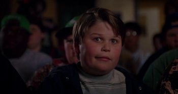 Movie still from “Heavyweights” (1995), directed by Steven Brill – A young boy is looking up at the sky; Close Up shot, Low angle