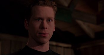 Movie still from “Heavyweights” (1995), directed by Steven Brill – A person wearing a black t - shirt; Close Up shot, Low angle