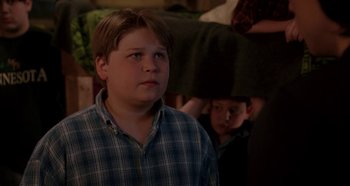 Movie still from “Heavyweights” (1995), directed by Steven Brill – A young boy standing in front of another young boy; Medium shot, Over the shoulder angle