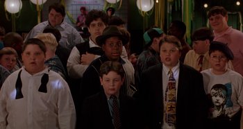 Movie still from “Heavyweights” (1995), directed by Steven Brill – A group of young men standing next to each other; Medium shot, High angle