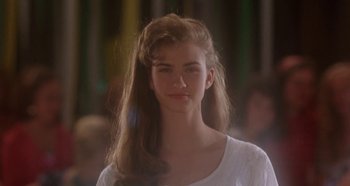Movie still from “Heavyweights” (1995), directed by Steven Brill – A woman with long hair and a white shirt; Close Up shot, Over the shoulder angle