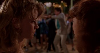 Movie still from “Heavyweights” (1995), directed by Steven Brill – Two young people are looking at each other in a crowd of onlookers; Close Up shot, Over the shoulder angle