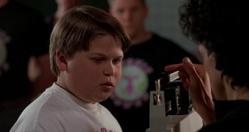 Movie still from “Heavyweights” (1995), directed by Steven Brill – A young boy is looking at a camera; Close Up shot, Low angle