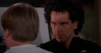 Movie still from “Heavyweights” (1995), directed by Steven Brill – A man that is staring at another man; Close Up shot, Over the shoulder angle