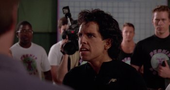 Movie still from “Heavyweights” (1995), directed by Steven Brill – A person with a video camera; Close Up shot, Over the shoulder angle
