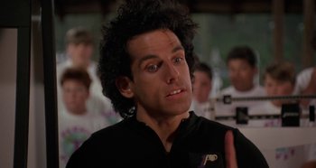 Movie still from “Heavyweights” (1995), directed by Steven Brill – A person wearing a black shirt; Close Up shot, Over the shoulder angle